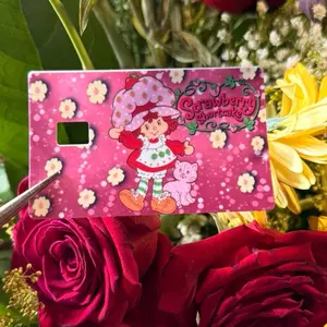 Fresita Sticker Card with Pink Background, Character Design, and Floral Elements