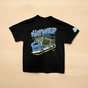 Haywild Tee 10lugmafia Is Black T-Shirt with Blue Graphic Design and "HAYWILD" Text Casual