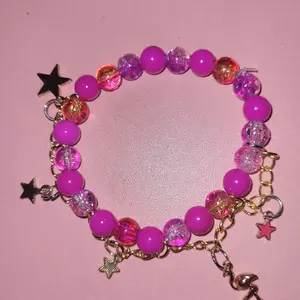 Limited Edition Pink Flamingo Charm Bracelet with Pink Beads and Star Charms on Gold-Tone Chain