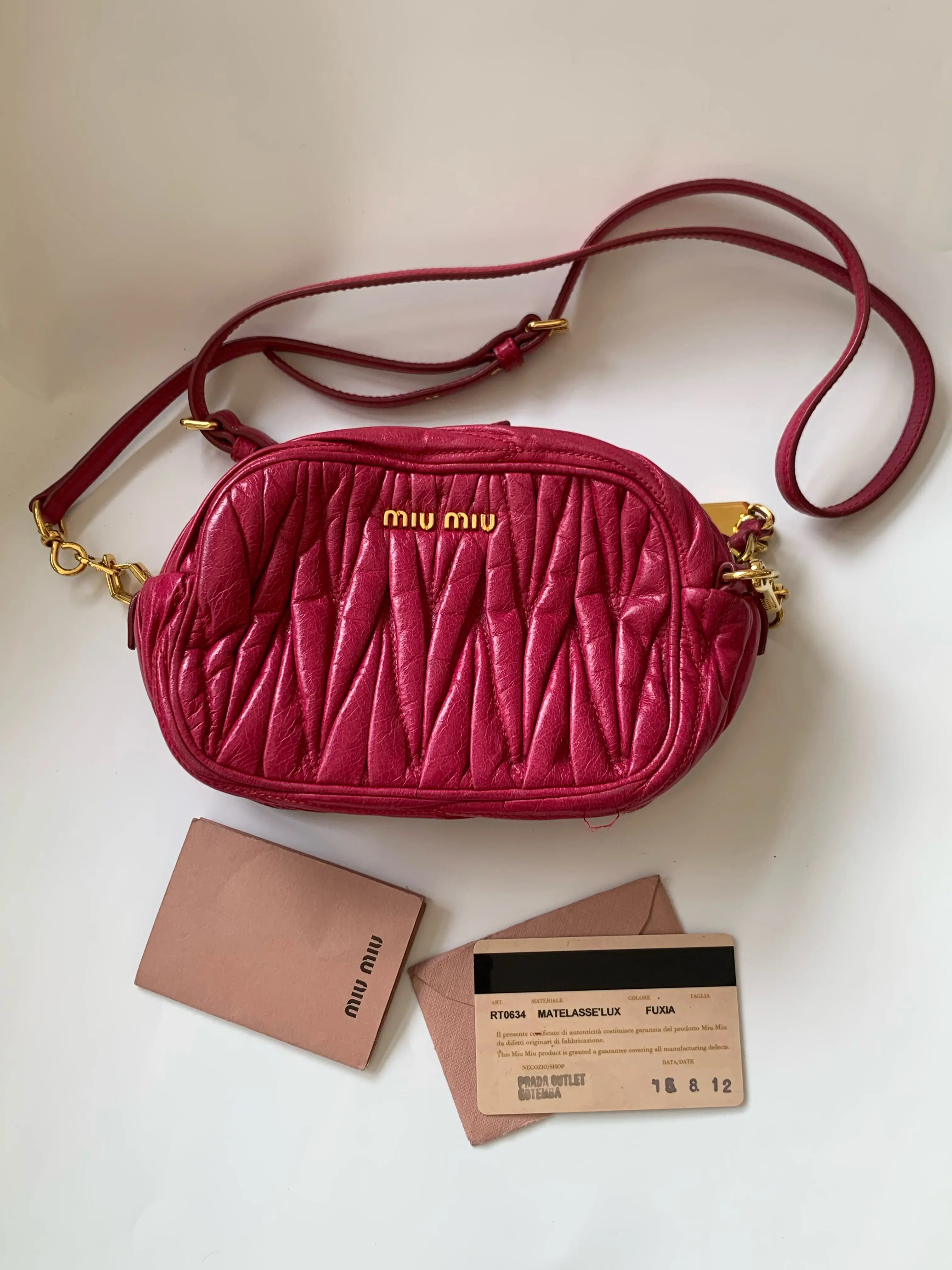 Pre-owned miu miu Ruched Twisted Mahjong Bag in Fuchsia Pink, 2012 Edition. Bottom Length: 15 cm. Comes with Long Shoulder Strap and Authenticity Card.