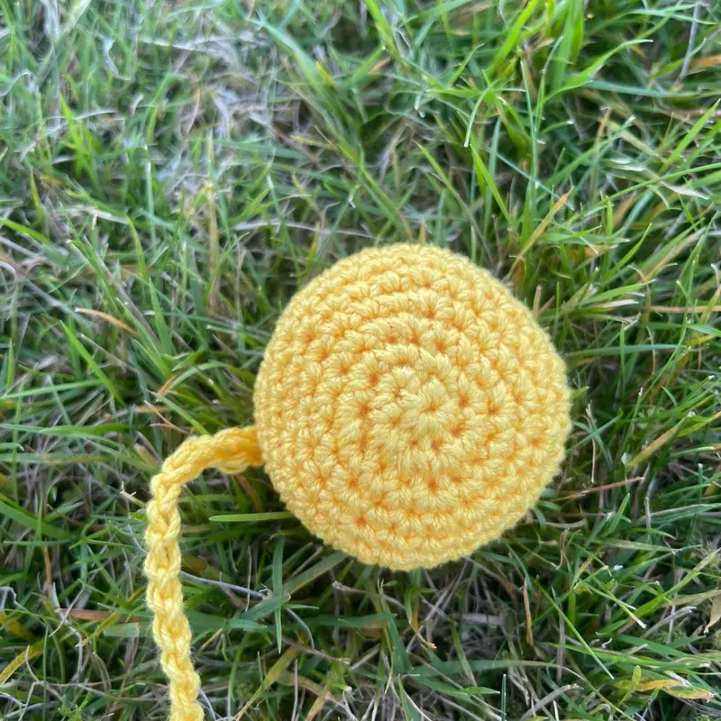 Yellow Hacky Sack with string for seniors or beginners
