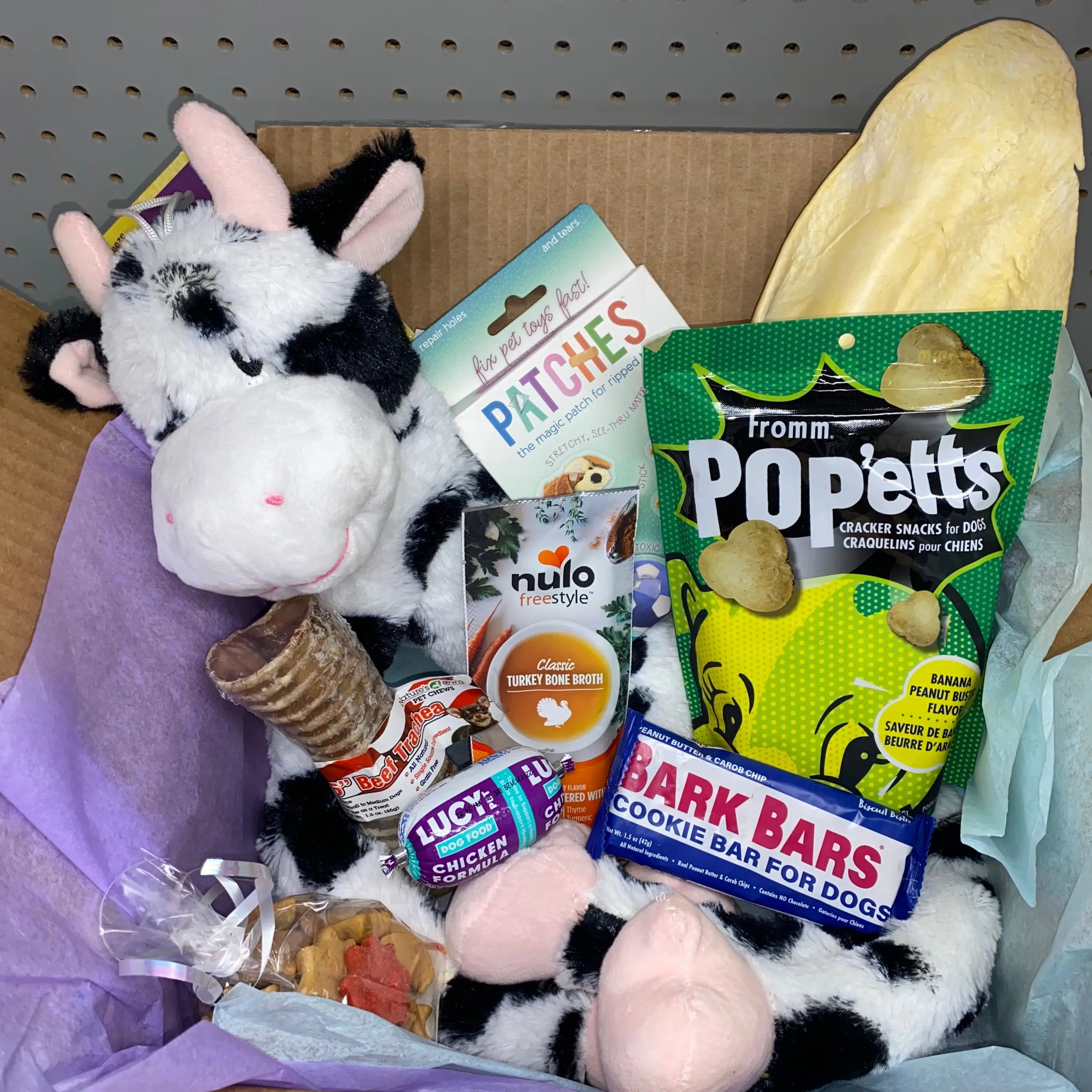 Buddy Box- A fun surprise box that includes miscellaneous toys and treats for your pup! Includes plush toys, treats, and fun new sample for your furry friend to try!