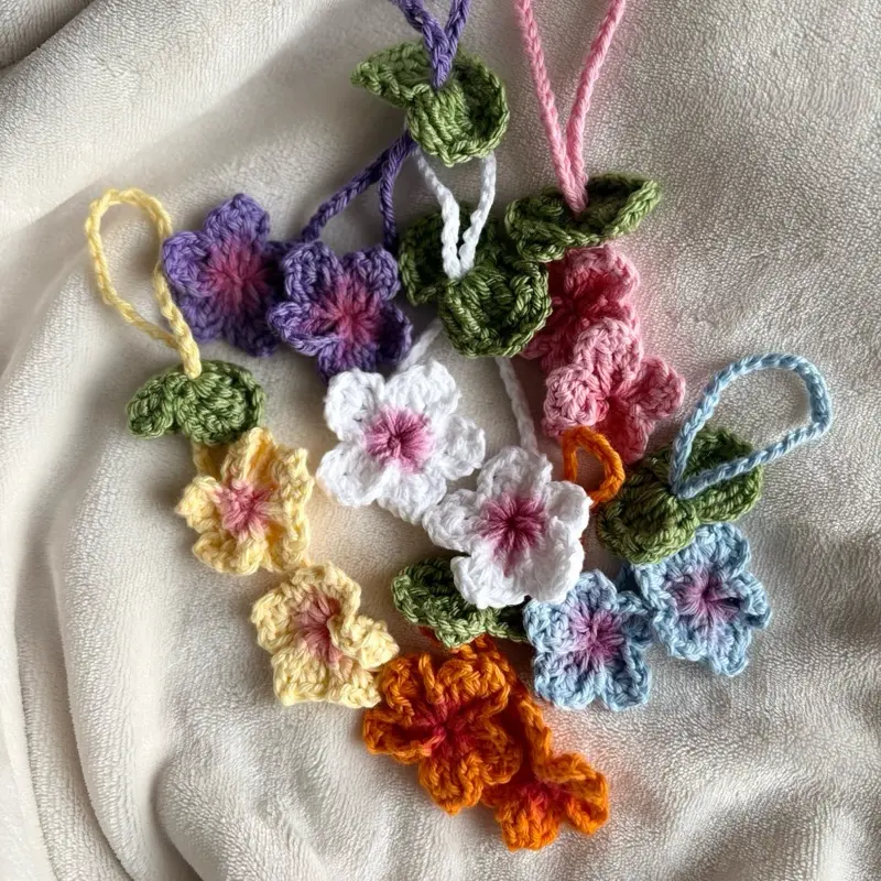 Handmade Crochet Flower Bag Charm - Soft Pink Centers & Green Leaf Accents - Perfect for Everyday Bags & Spring Outfits