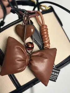 Brown Miu Series Bag Charm Purse Charm Textured Leather Stylish HighEnd Handmade Autumn Winter Brown Bag Pendant withBow and Heart Accents