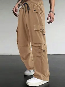 Men's solid - color cargo loose straight - leg pants, featuring a multi - pocket design and an adjustable drawstring waist. They are ideal as loose - fit trousers for the back - to - school season and versatile casual pants suitable for all seasons.