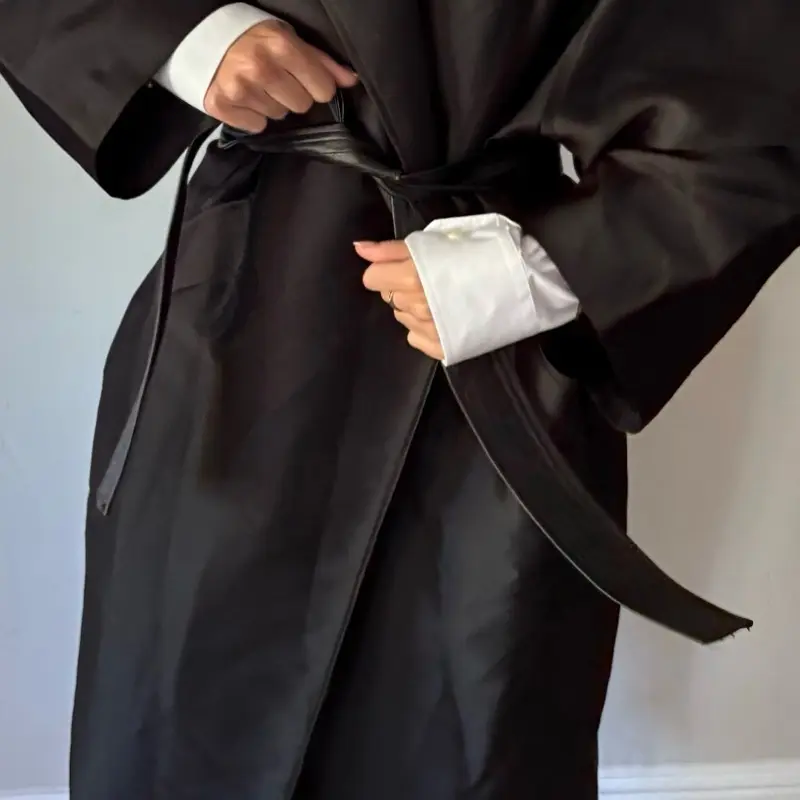Oversized Black Trench Coat with Leather Waist Belt Minimalist High Collar Design Modern Parisian Style Satin-Finish Fabric