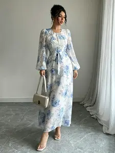 A women's white and blue fashionable floral print waist cinching long dress, with floral print showing tenderness and waist cinching design showing thinness, suitable for commuting to work, shopping and outdoor activities, indoor and outdoor dressing