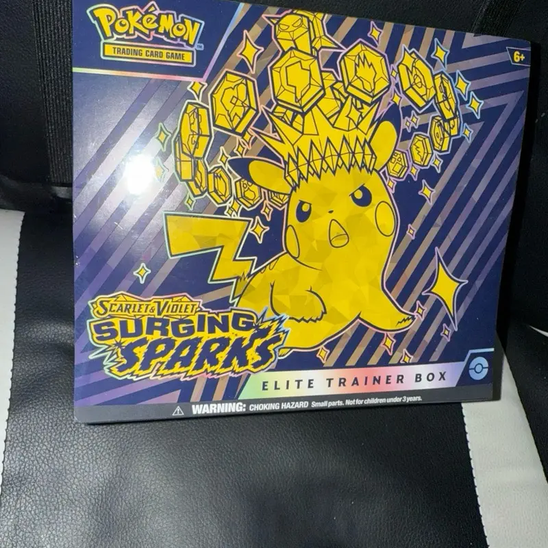 Pokmon Scarlet & Violet Surging Sparks Elite Trainer Box - Official Trading  Card Game Set for Collectors - TikTok Shop