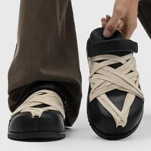 Men’s Black Leather Cross‑Strap Platform Mules with beige woven fabric laces for utility style. Adjustable leather strap offers customized fit. Soft leather brings comfy wear, thick non‑slip sole boosts leg‑lengthening effect.