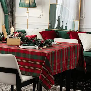 Christmas tablecloth in red, checkered rectangular design. Metallic woven fabric tablecloth with dust-proof and wrinkle-resistant properties. Heavyweight polyester construction, ideal for festive kitchen dining tables.