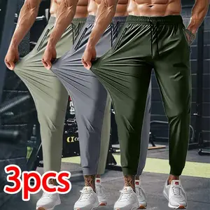 Men’s 3-pack high-stretch jogger pants, quick-dry breathable fabric, drawstring elastic waistband, zippered pockets, tapered slim fit—a versatile choice for fitness, training, running, and everyday wear.