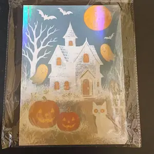 Halloween Notebook with Ghosts, Pumpkins, and a Cat Design