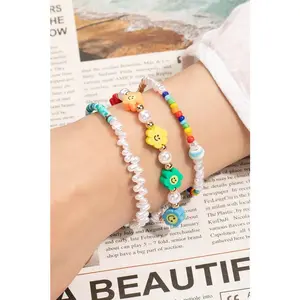 LA3accessories Smiley face and pearl layered bracelet