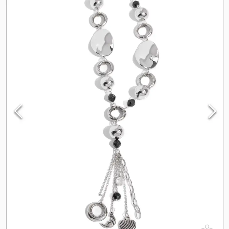 Total Eclipse Of The Heart Necklace with Unique Design Elements and Charms