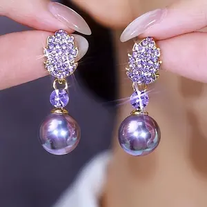 A pair of earrings that perfectly combine elegance and fashion, featuring faux gemstone purple maple leaves and purple faux pearl pendants, suitable as a gift for Mother's Day, Valentine's Day, or Christmas to surprise your loved ones