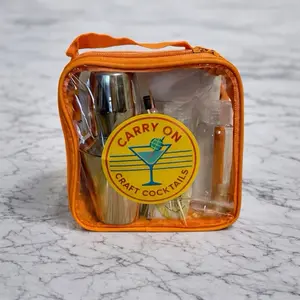 Travel-friendly Cocktail Kit with Carry On Craft Cocktails Logo and Essential Mixology Tools