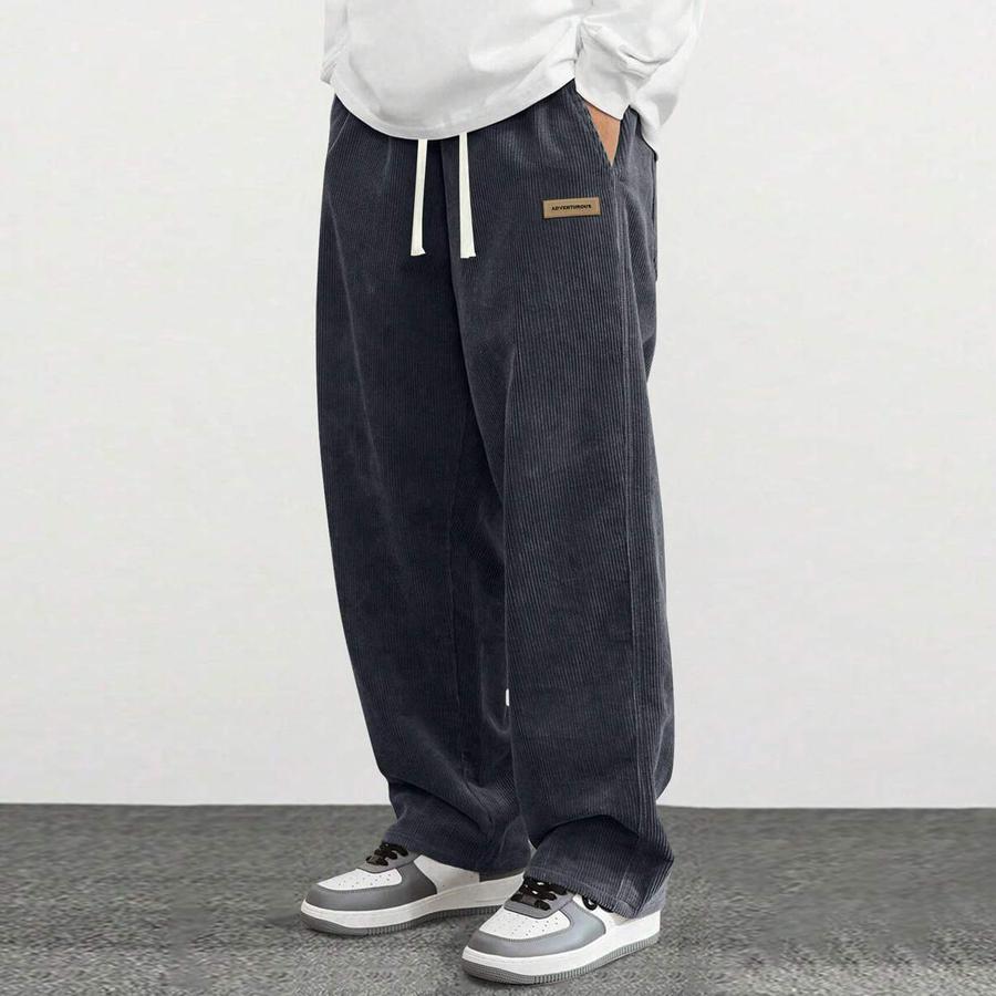 Men’s corduroy casual pants, loose straight fit, simple and versatile, suitable for spring and autumn wear.