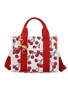 Personalized and trendy exquisite women's crossbody bag shoulder bag, casual trendy bag, simple and niche, cherry patterned women's bag with design sense, with cherry pendant, suitable for daily occasions such as commuting, shopping, parties, dates, etc.
