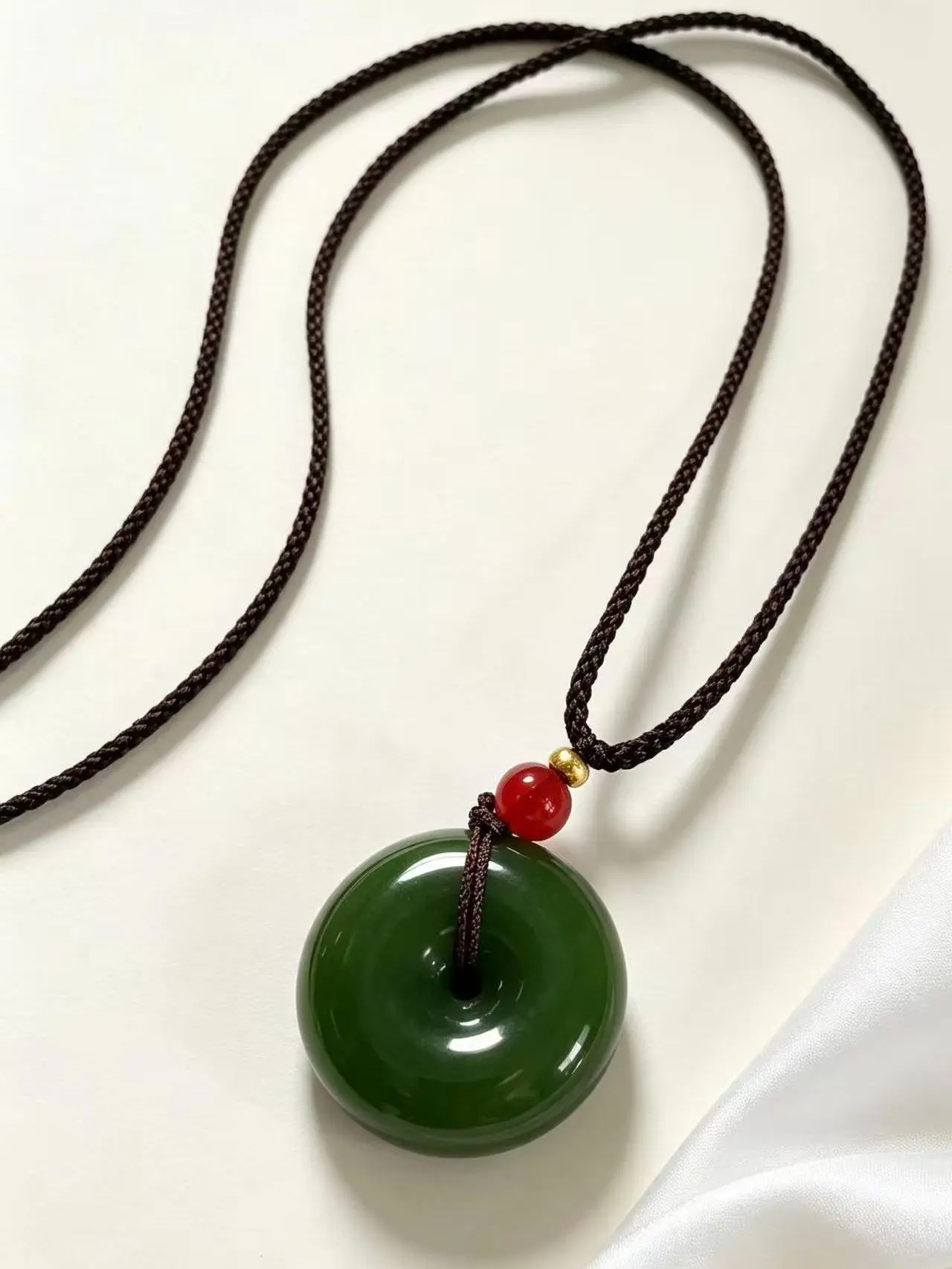 Z.Deep green ice-like “Peace” pendant collectible — fully polished glossy finish, minimalist design — versatile unisex piece, rare stone carving