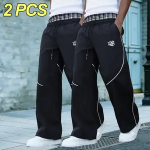 Men’s high-street wide-leg pants with a drapey feel and patchwork plaid pattern; white striped design on the pant body. Comfortable, breathable long pants with an elastic waistband and adjustable drawstring at the waist—ideal for trendy streetwear, daily