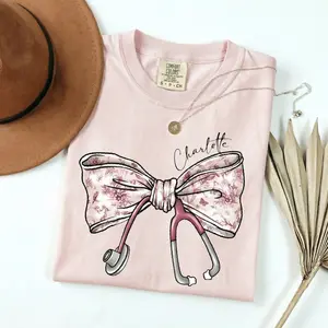 Comfort Colors [Custom name] Nurse Toile Bow Sweatshirt, Stethoscope Bow Shirt, Nurse Coquette Tee, Personalized Gift for Nurse Week, Healthcare Professionals Tee Womenswear Streetwear