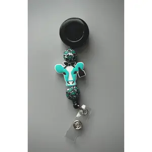 Western Turquoise Cow Badge Reel