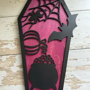 Halloween Wall Decor with a Spider,  Bat, Pumpkin & Witches Cauldron Bubbling on Purple Coffin Shaped Background Black Silhouette