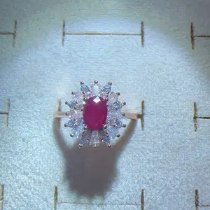 <PingEast jewelry > Ruby ring503--925 Sterling Silver Ring Plated with 18K Rose Gold, Featuring a 4*6mm Natural Burmese Pigeon Blood Ruby, Surrounded by Natural White Crystals in a Sunflower Design, with Certificate