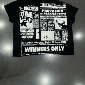 Prevaloir Newspaper Tee Prevaloir Newspaper Tee