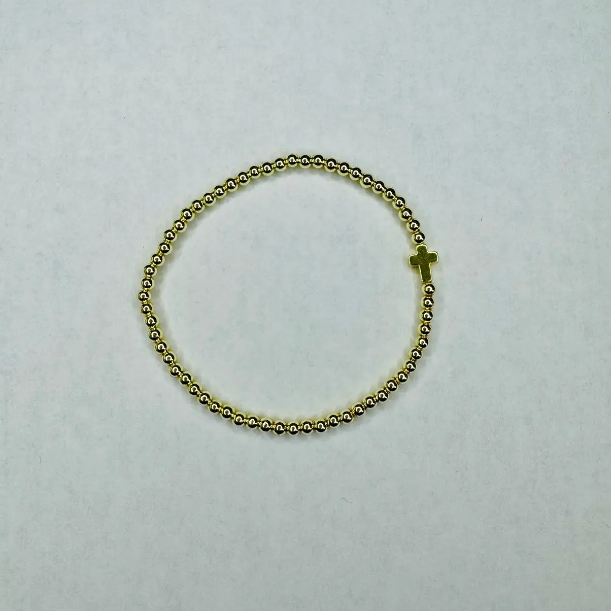 The Blessing Bracelet This 6.5" stretchy bracelet is a beautiful accessory that can be worn comfortably. The bracelet is made with 4mm gold plated hematite gem stone beads.  In addition to the gem stone beads, the bracelet also features a gold plated hema