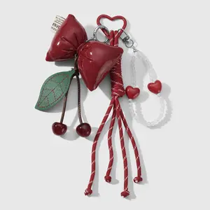1 piece Miu-style charm featuring a sweet yet cool trendy design; high aesthetic appeal; multicolor beaded heart; CCB leather bow, leaf, and cherry woven cord keychain/bag pendant; suitable for women’s everyday wear; ideal as a holiday gift.