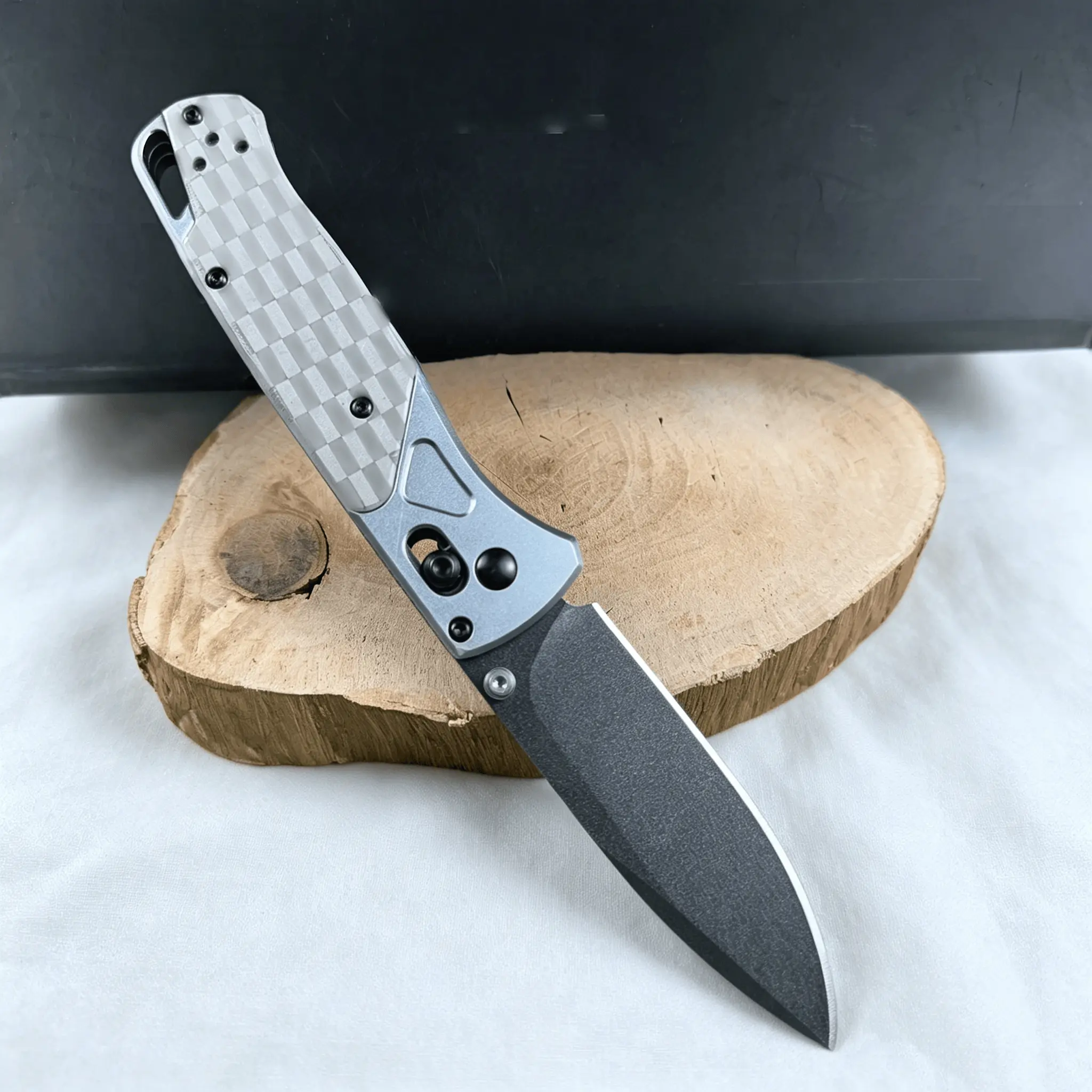 A portable, folding knife featuring an Axis Lock mechanism, a textured handle, hardness corrosion-resistant blade and a black-coated blade—an exceptional piece of everyday carry (EDC) gear and an essential companion for outdoor adventures.