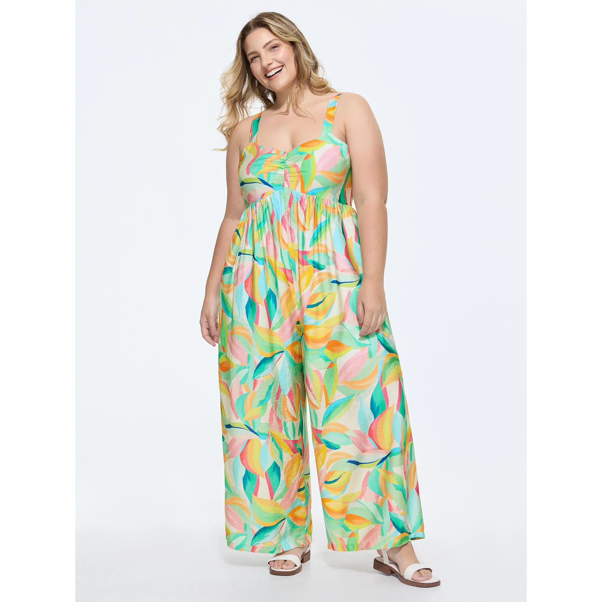 BloomChic Women's Plus Size Playful Leaf Print Sleeveless Smocked Jumpsuit - Bowknot Detail, Side Pockets, Smocked Waist, Smooth Rayon-Nylon Blend Fabric, Low Iron, Cold Wash, Do Not Tumble Dry