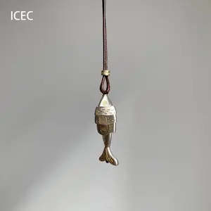 A vintage vinage cold style small fish pendant necklace with a niche design and exquisite long autumn and winter sweater chain