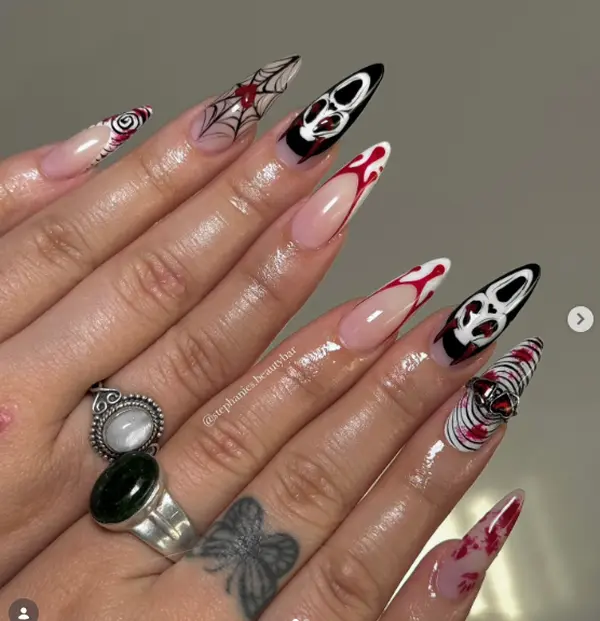 Gothic Scream Stiletto Nails with Red Drips, Spiderwebs, Spiral Art and Horror Faces – Creepy Halloween Statement Nail Design Trend