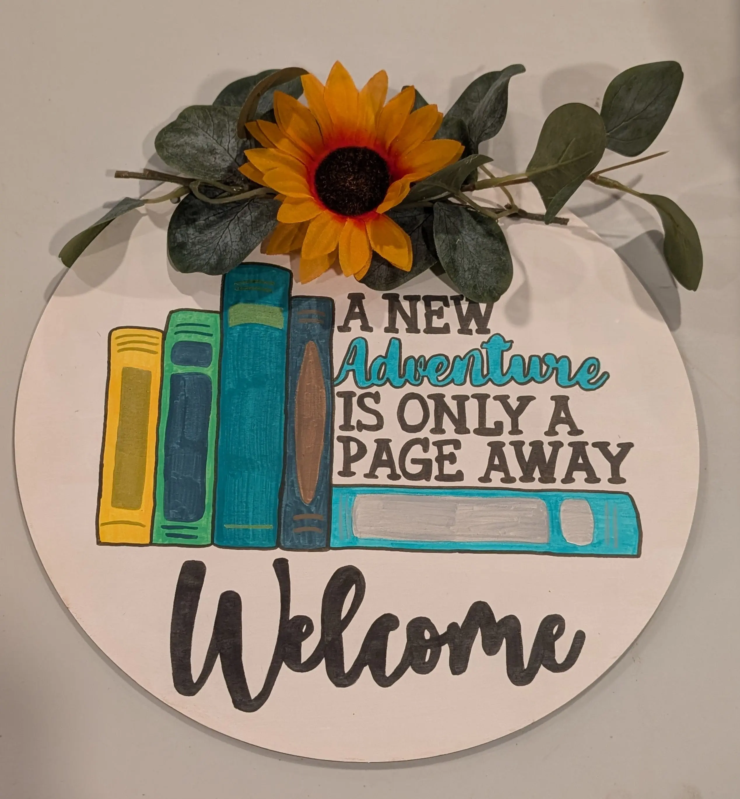 A New Adventure is Only a Page Away Sign