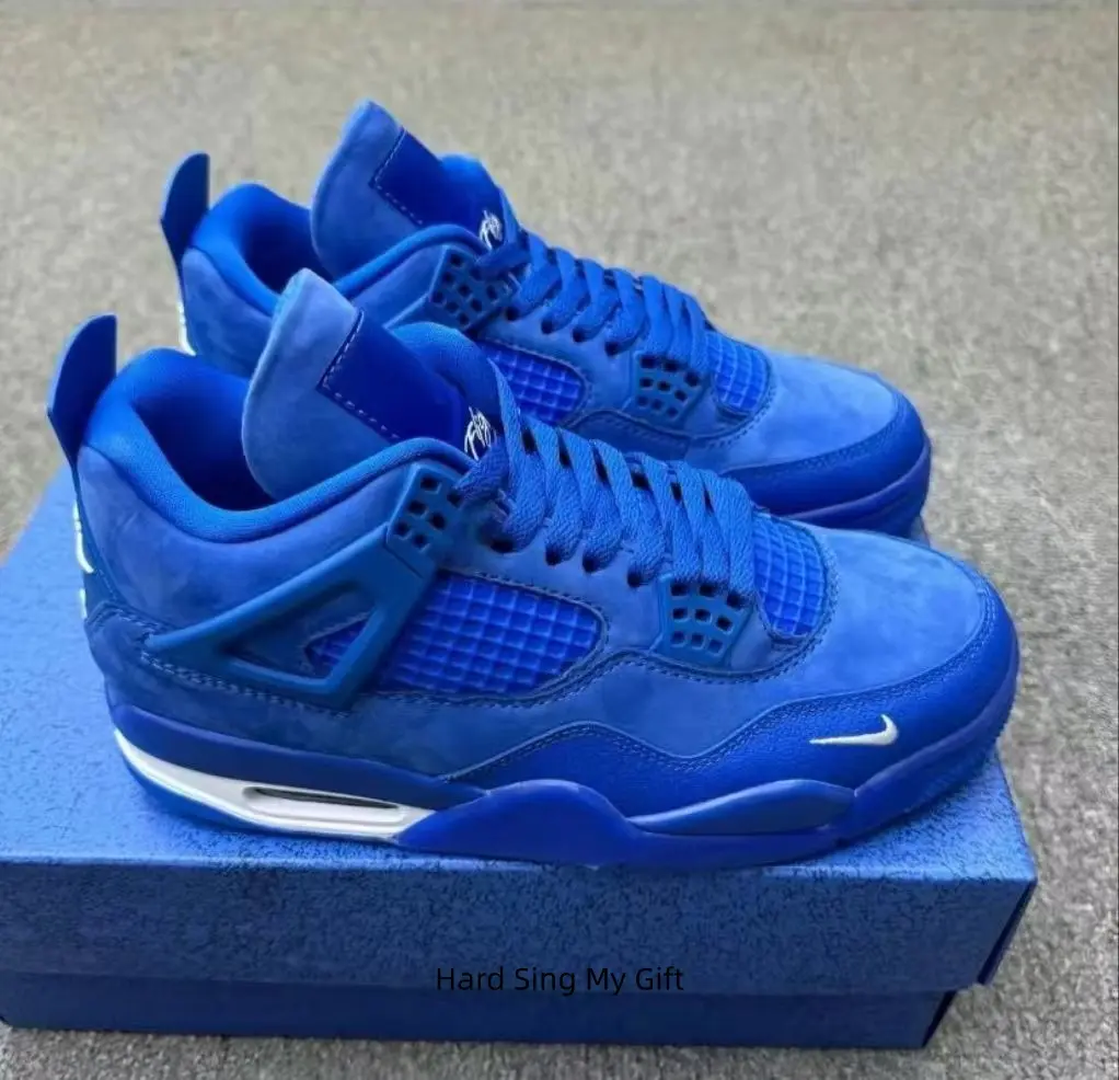 Vintage basketball style sneakers, matte royal blue suede upper paired with perforated blue mesh, blue structural side pieces, blue midsole and subtle white accents.