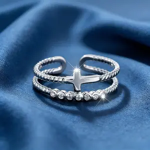 A stylish, openwork double-layered cross crystal ring with a unique, trendy, and sophisticated feel.