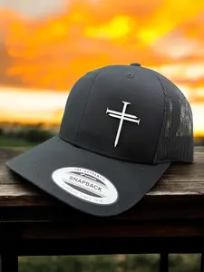 Nail Cross Acrylic Patch Hat on a Black Trucker Cap with Authentic Snapback Logo