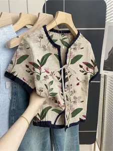 Women's khaki bohemian vacation short-sleeve knit top. Loose round neck, contrast leaf and floral print, front tie and contrast piping. Comfortable for spring & summer casual wear.