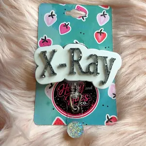 X-Ray glitter letters badge reel