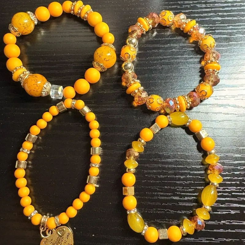 Dreamy Charms – 4-Piece Yellow & Gold Bracelet Set