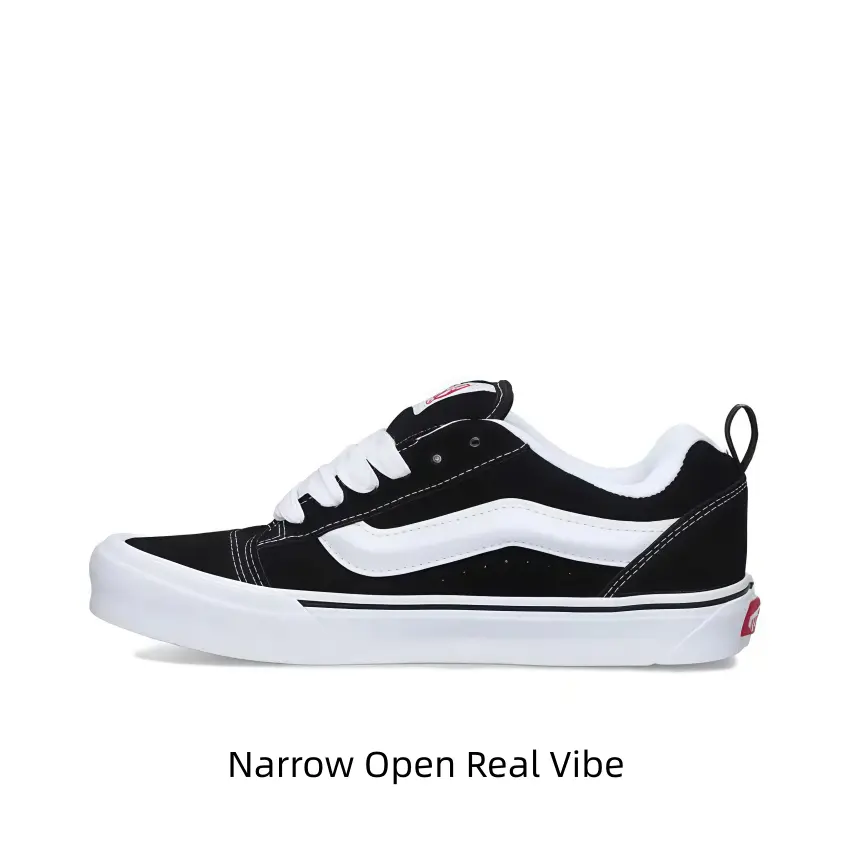 Textured black suede canvas lace-up skate trainers with thick fluffy white laces and oversized wavy white side graphic, grippy layered white rubber sole, perfect for skate fits, dark denim and edgy all-day streetwear looks.