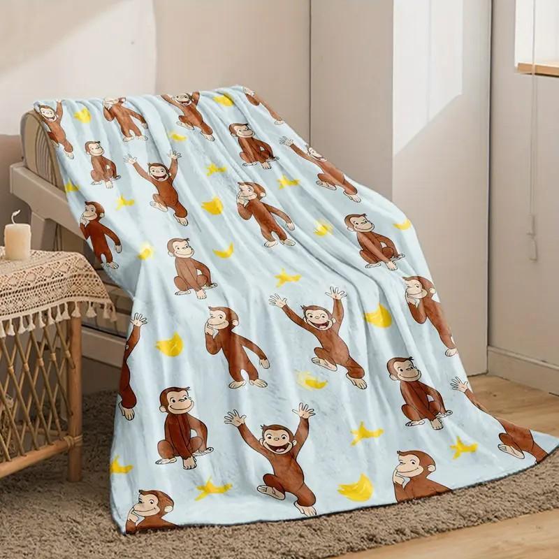 digital printed flannel Warm Throw Blanket with a Curious George monkey and banana pattern, suitable for sofas, beds, travel, camping, and office use. Made of warm, comfortable, and soft fabric, machine washable, for birthday and holiday gifts
