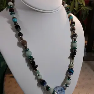 Bead Stew, no rhyme no reason.  Just a fun wearable neclace . You pick how many strands you want, the colors and length.  You asked for it you got it, an inexpensive necklace of your choosing