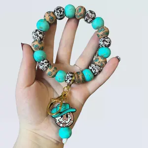 Cowhide smiley wristlet keychain