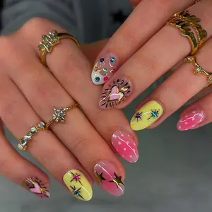 24 pieces of almond press on nails varnish with gradient wave dots, gold-plated hearts, dazzling golden star rays, combined with blue, yellow, green, purple color diamonds. Classic white French-style edges, pulsating hearts fake nails
