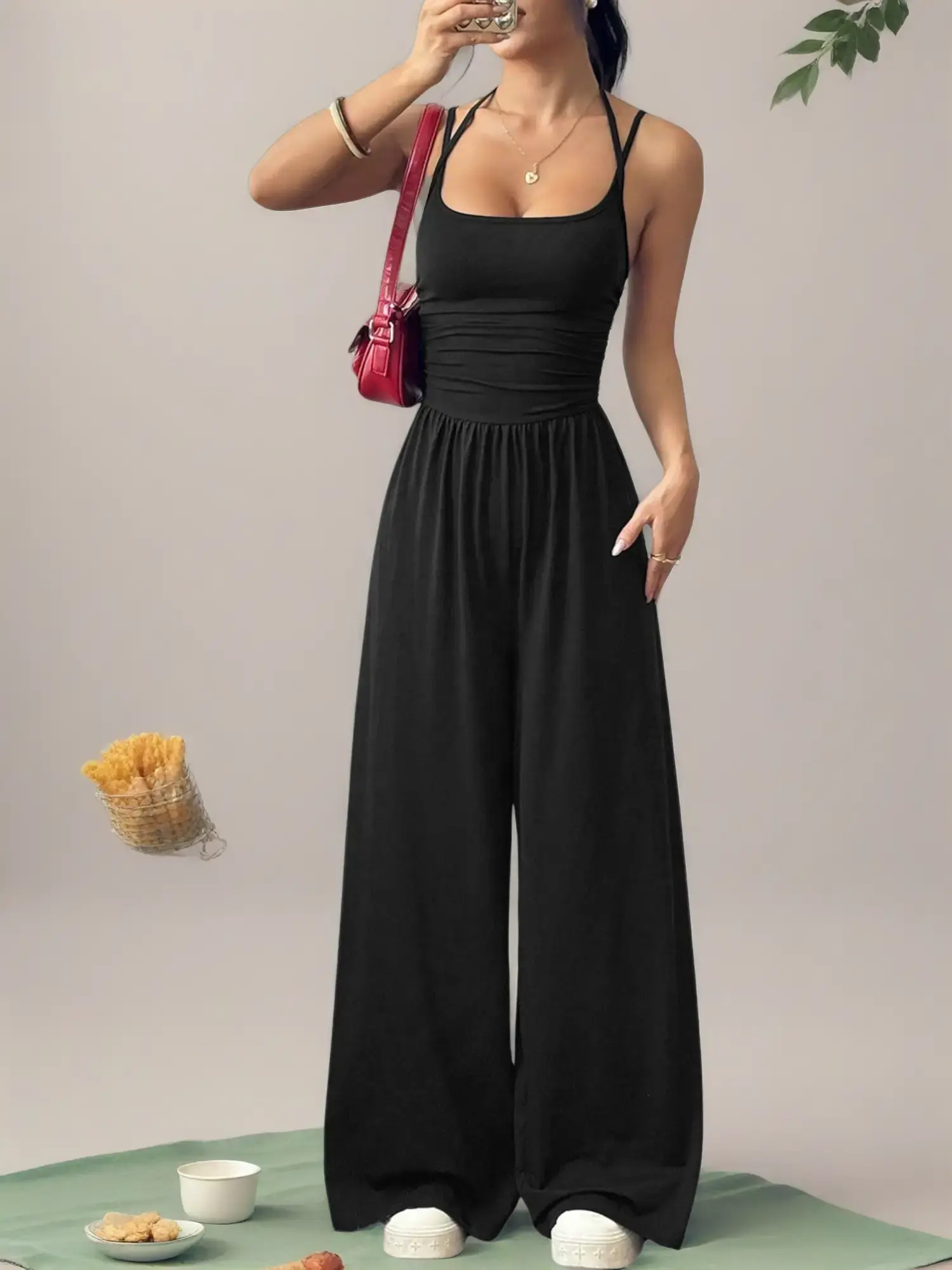 Available in multiple colors; European/American style solid color halter camisole jumpsuit for women featuring ruched high waist, drapey floor-length wide legs; spring/summer casual vacation loose sleeveless jumpsuit