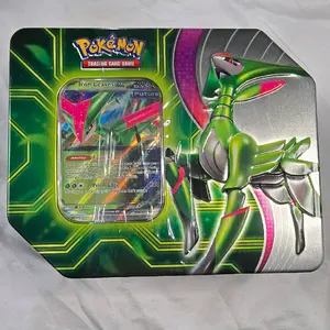 Pokémon TCG Paradox Clash Tin Includes 5 booster packs.