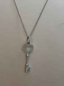 Pre-owned Tiffany & Co, white gold half paved mini love key pendant
